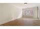 Bright, airy bedroom with hardwood floors and large windows at 77 Peachtree Ne Pl # 402, Atlanta, GA 30309