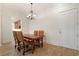 Dining area featuring a chandelier, hardwood floors, and a view into the kitchen space at 77 Peachtree Ne Pl # 402, Atlanta, GA 30309