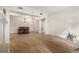 Dining area featuring a chandelier, hardwood floors, and an open doorway to another room at 77 Peachtree Ne Pl # 402, Atlanta, GA 30309