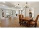 Open concept living space featuring a fireplace, hardwood floors, and an adjacent dining area and kitchen at 77 Peachtree Ne Pl # 402, Atlanta, GA 30309