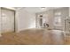 Bright living room with hardwood floors, with large windows leading to a small balcony at 77 Peachtree Ne Pl # 402, Atlanta, GA 30309