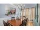 Formal dining room with hardwood floors, wainscoting, and a chandelier, ideal for Gathering dinners at 1115 Harvest Brook Ne Way, Lawrenceville, GA 30043