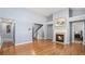 Open living space boasting hardwood floors, a fireplace, and a staircase, perfect for entertaining guests at 1115 Harvest Brook Ne Way, Lawrenceville, GA 30043