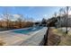 Community pool is covered, tennis court and playground area are located to the side at 1115 Harvest Brook Ne Way, Lawrenceville, GA 30043