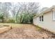 Large backyard with trees and small retaining wall, off back of house at 2504 Brentwood Rd, Decatur, GA 30032