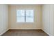 This bedroom features neutral walls, a double-paned window, and plush carpeting at 2504 Brentwood Rd, Decatur, GA 30032