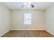 This bedroom boasts neutral walls, plush carpeting, and a window at 2504 Brentwood Rd, Decatur, GA 30032