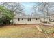 Rear exterior view with access to the carport and yard at 2504 Brentwood Rd, Decatur, GA 30032