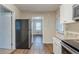 Updated kitchen with stainless appliances, granite countertops, and hardwood flooring at 2504 Brentwood Rd, Decatur, GA 30032