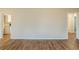 Open living room with hardwood floors and entry ways to the kitchen and bedroom areas at 2504 Brentwood Rd, Decatur, GA 30032