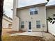 Cozy backyard featuring a small concrete patio, perfect for outdoor relaxation at 46 Darbys Crossing Ct, Hiram, GA 30141