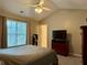 This bedroom offers a neutral color palette, fan, and a view out of the window at 46 Darbys Crossing Ct, Hiram, GA 30141