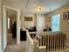 Upstairs loft with a seating area, multiple windows, and a doorway to another room at 46 Darbys Crossing Ct, Hiram, GA 30141