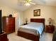Serene main bedroom with a comfortable bed, side tables and neutral decor at 46 Darbys Crossing Ct, Hiram, GA 30141