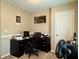 Functional home office with a desk, a chair, and ample lighting for a productive workspace at 46 Darbys Crossing Ct, Hiram, GA 30141
