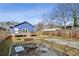 Large backyard with a fire pit area, an outdoor seating area, and a well-maintained lawn at 726 Brookline Sw St, Atlanta, GA 30310