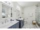 Elegant bathroom with marble countertops, double sinks, and a glass-enclosed shower at 726 Brookline Sw St, Atlanta, GA 30310