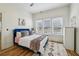 Bright bedroom boasts natural light, wood floors, and stylish decor at 726 Brookline Sw St, Atlanta, GA 30310