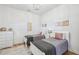 Cozy bedroom featuring twin beds, a modern chandelier, and hardwood flooring at 726 Brookline Sw St, Atlanta, GA 30310