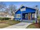 Charming blue home featuring a welcoming front porch and well-maintained yard at 726 Brookline Sw St, Atlanta, GA 30310