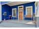 Inviting front porch featuring a wooden door and comfortable seating area at 726 Brookline Sw St, Atlanta, GA 30310