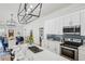 Modern kitchen with white cabinets, stainless appliances, marble countertops, and an open layout at 726 Brookline Sw St, Atlanta, GA 30310