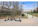 Scenic park view featuring shared scooters parked on a paved surface near a green space at 726 Brookline Sw St, Atlanta, GA 30310