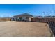 Spacious fenced-in backyard with ample lawn space, perfect for outdoor activities and entertaining, on a sunny day at 8125 Berrywood Se Ct, Covington, GA 30014