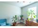 Bright bedroom with plants, hardwood floors and a ceiling fan at 8125 Berrywood Se Ct, Covington, GA 30014