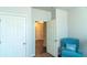 Bright bedroom with blue chair and a window at 8125 Berrywood Se Ct, Covington, GA 30014