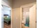 Hallway with doors to a bedroom and bathroom, showcasing the home's layout at 8125 Berrywood Se Ct, Covington, GA 30014