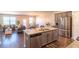 An open-concept kitchen featuring stainless steel appliances and granite countertops at 8125 Berrywood Se Ct, Covington, GA 30014