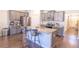 Kitchen with stainless steel appliances, granite countertops and an eat-in island at 8125 Berrywood Se Ct, Covington, GA 30014