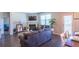 Cozy living room with fireplace open to the kitchen and dining areas at 8125 Berrywood Se Ct, Covington, GA 30014