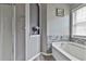 Bathroom featuring a soaking tub with tile accents and a built-in niche for toiletries and decor at 2726 Northgate Nw Way, Acworth, GA 30101
