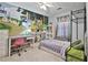 Charming bedroom with a whimsical mural, a cozy bed, and a dedicated study area for children at 2726 Northgate Nw Way, Acworth, GA 30101