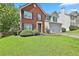 Traditional two-story house with brick and siding, green lawn, and attractive landscaping at 2726 Northgate Nw Way, Acworth, GA 30101