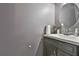 Clean powder room featuring a modern sink, grey vanity, and stylish mirror at 2726 Northgate Nw Way, Acworth, GA 30101