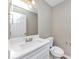 Bathroom with a white sink, toilet, and neutral wall paint at 3060 White Oak Mews, Decatur, GA 30034