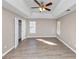 Spacious bedroom featuring a tray ceiling, ceiling fan and closet at 3060 White Oak Mews, Decatur, GA 30034