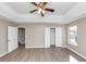 Spacious bedroom featuring a tray ceiling, ceiling fan and two closets at 3060 White Oak Mews, Decatur, GA 30034