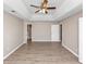 Spacious bedroom featuring a tray ceiling, ceiling fan and two closets at 3060 White Oak Mews, Decatur, GA 30034