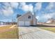 Two-story house with gray siding, a spacious driveway, an attached two-car garage, and a well-kept lawn at 3060 White Oak Mews, Decatur, GA 30034