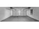 Spacious two car garage with new garage door openers, a window, and smooth concrete flooring at 3060 White Oak Mews, Decatur, GA 30034