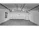 Open garage with smooth concrete floors, new garage door openers, and a window at 3060 White Oak Mews, Decatur, GA 30034