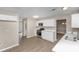 View of the kitchen featuring stainless steel appliances, white cabinets, and hardwood flooring at 3060 White Oak Mews, Decatur, GA 30034