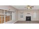 A view of a spacious living room with a fireplace and natural lighting at 3060 White Oak Mews, Decatur, GA 30034
