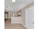 View of the room and kitchen area showcasing the hardwood floors and natural light at 3060 White Oak Mews, Decatur, GA 30034