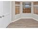 Room featuring natural light from the windows, complemented by wood-look flooring at 3060 White Oak Mews, Decatur, GA 30034