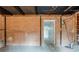 Unfinished basement with a brick wall, concrete floor, and an open doorway leading to another room at 3368 Windsor Castle Ct, Decatur, GA 30034